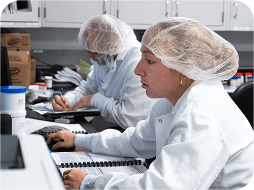 Blistex employee's working in a lab